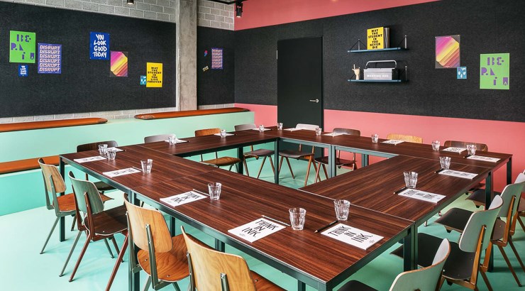 the student hotel berlin green and pink meeting room